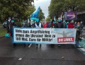 Banner von Protestteilnehmenden aus Der Linken